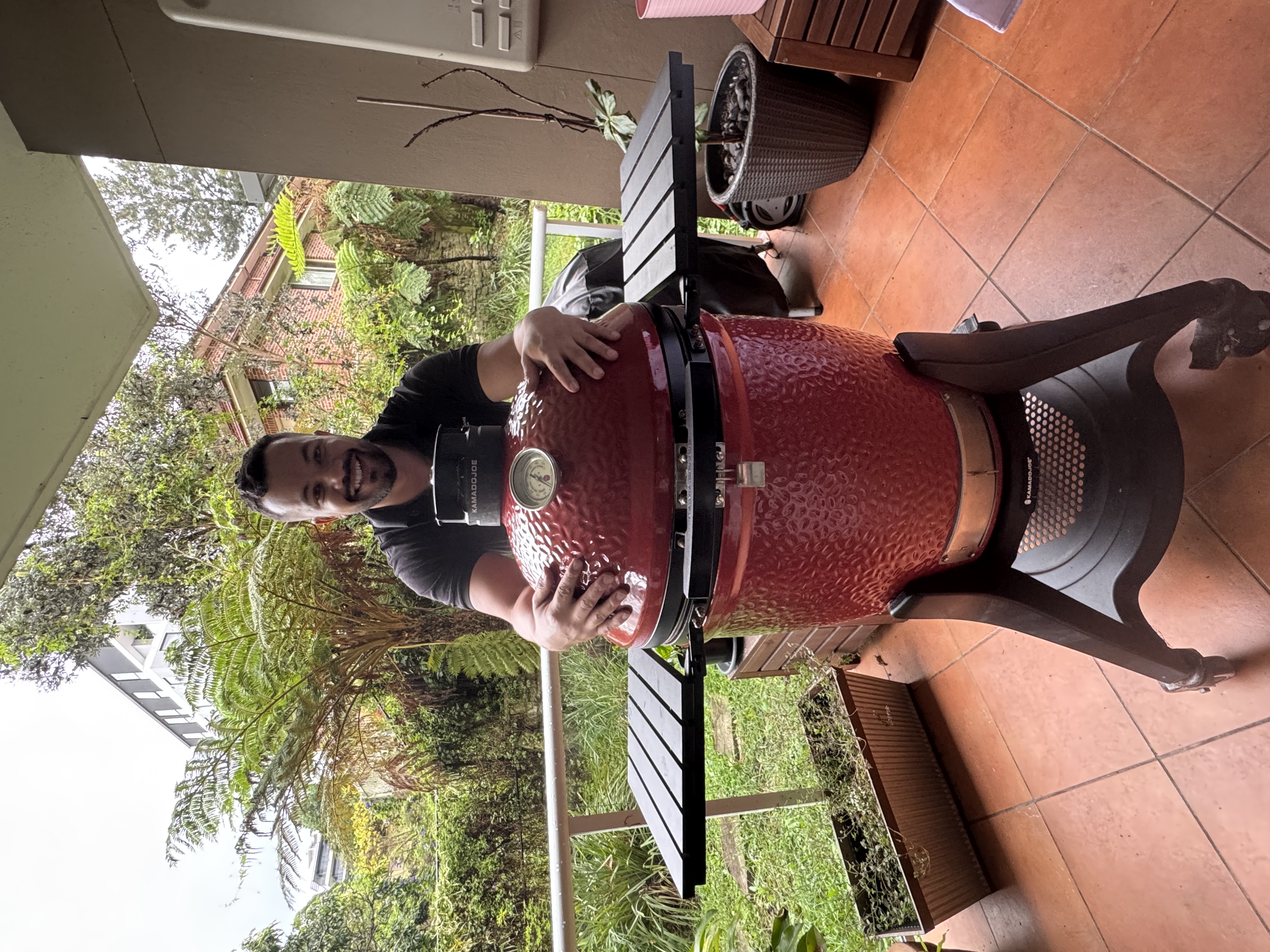 Diego with his Kamado Joe BBQ on the balcony in Sydney